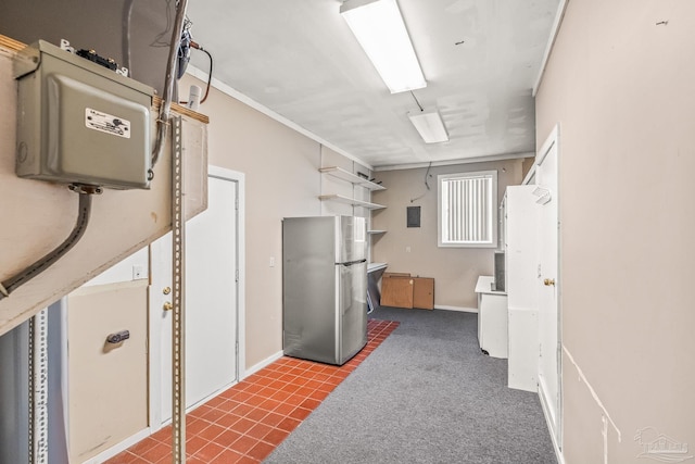 kitchen featuring stainless steel refrigerator and crown molding