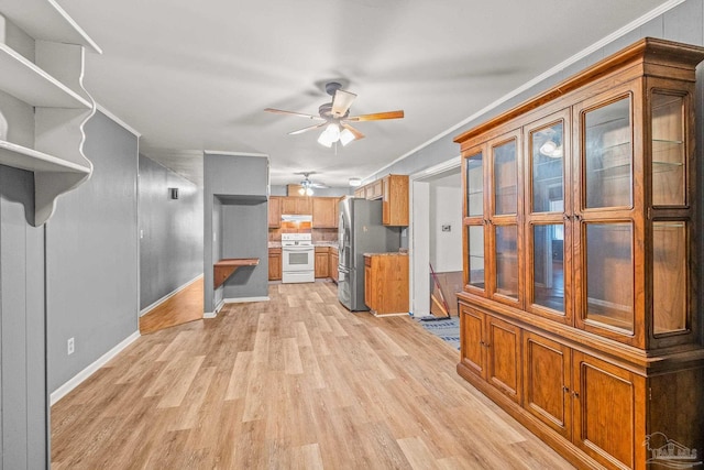 unfurnished living room featuring light wood-type flooring and ornamental molding