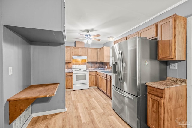 kitchen with ceiling fan, tasteful backsplash, stainless steel fridge with ice dispenser, white range with electric cooktop, and light wood-type flooring