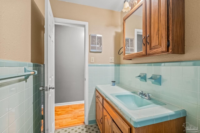 bathroom with hardwood / wood-style floors and vanity