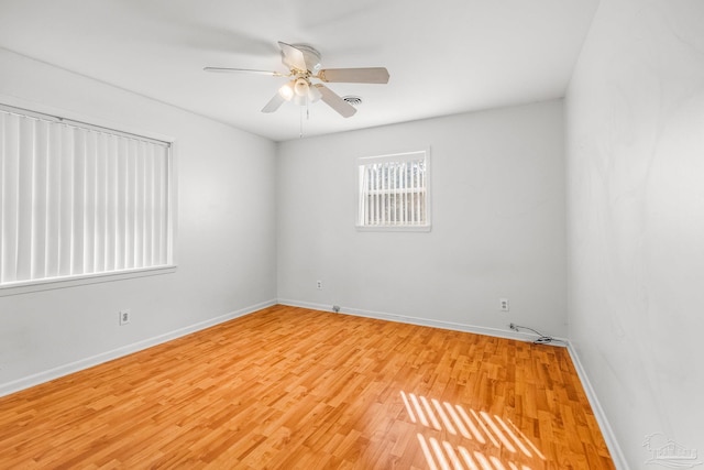 spare room with ceiling fan and light hardwood / wood-style flooring