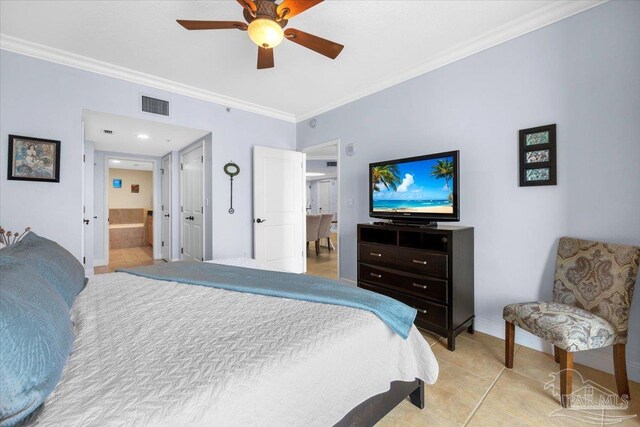 bedroom with ceiling fan, light tile patterned flooring, ornamental molding, and ensuite bath