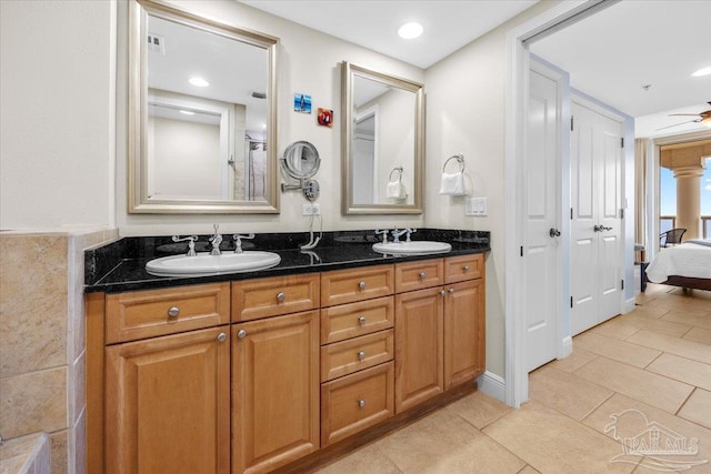 bathroom featuring ceiling fan, tile patterned flooring, and vanity