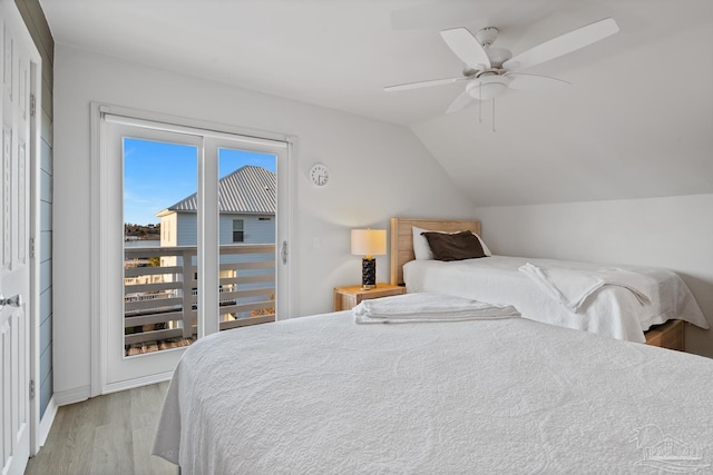 bedroom featuring a ceiling fan, lofted ceiling, and light wood finished floors