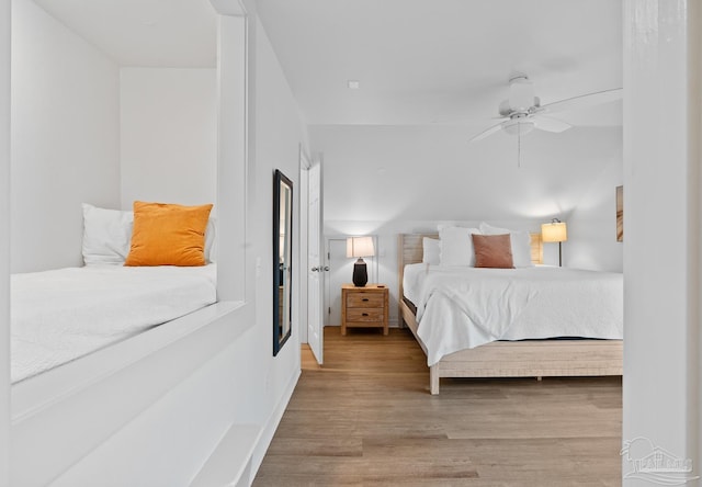 bedroom featuring a ceiling fan and wood finished floors