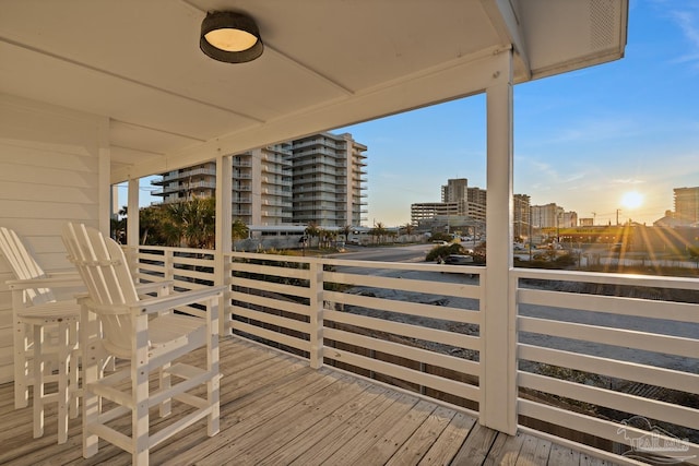 deck at dusk with a city view
