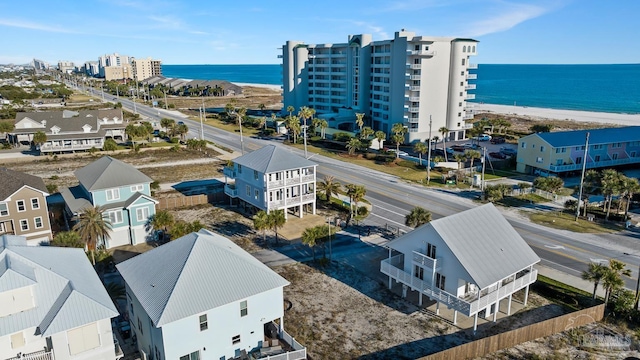 aerial view featuring a water view and a view of the beach