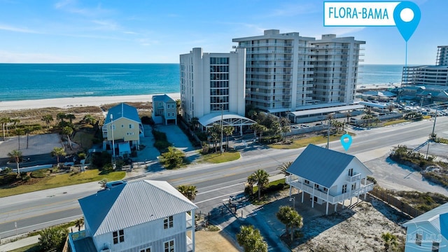 bird's eye view featuring a view of the beach and a water view