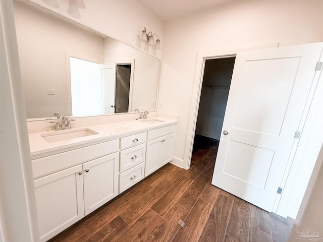 bathroom featuring vanity and wood-type flooring