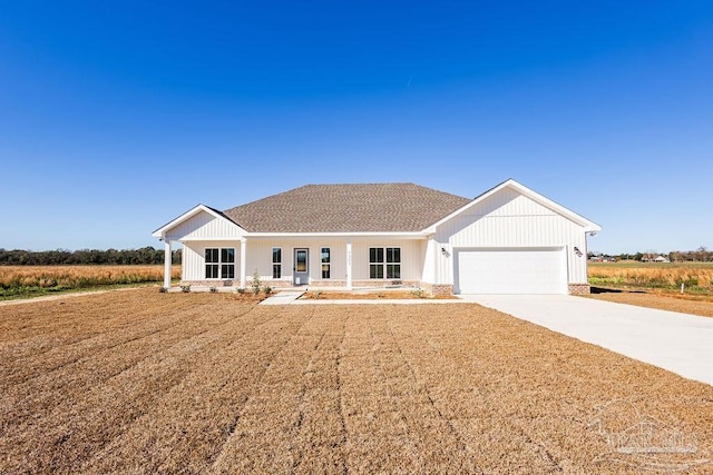 modern inspired farmhouse featuring a garage