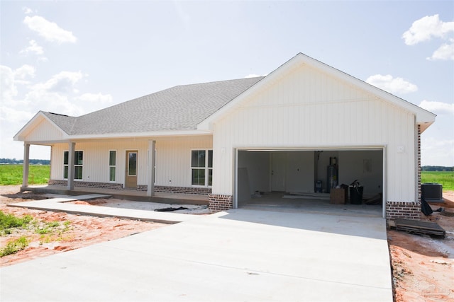 view of front facade with a garage and covered porch