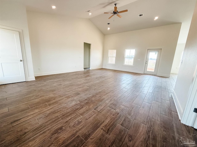 unfurnished living room with dark hardwood / wood-style floors, high vaulted ceiling, and ceiling fan