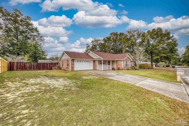 ranch-style house featuring a garage and a front lawn