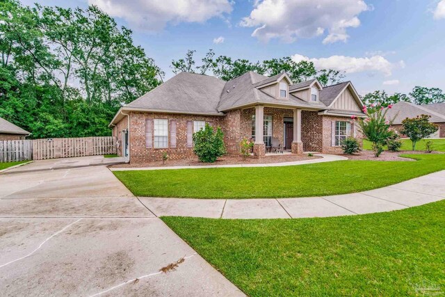 craftsman-style home with a front lawn