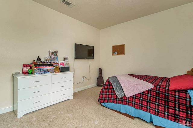 bedroom with light carpet