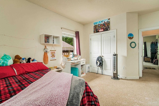 carpeted bedroom featuring a closet