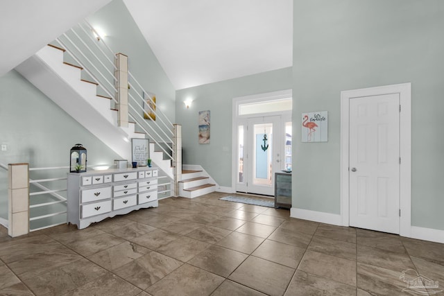 foyer with high vaulted ceiling