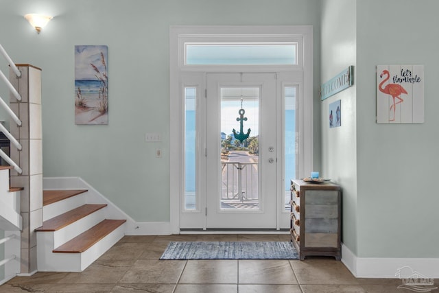 entryway with tile patterned floors