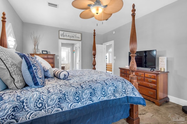 carpeted bedroom with ceiling fan and ensuite bathroom