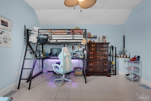 tiled bedroom with lofted ceiling