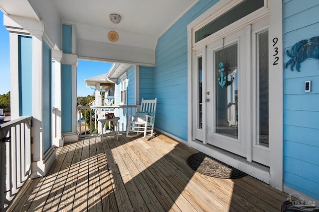 wooden terrace featuring a porch