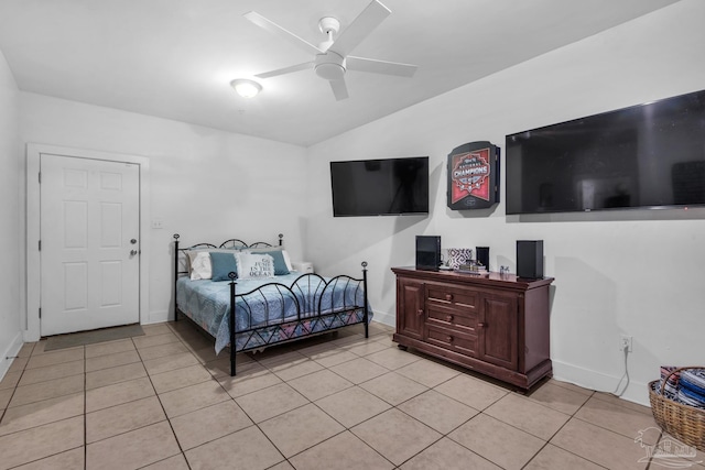 bedroom with ceiling fan and light tile patterned floors