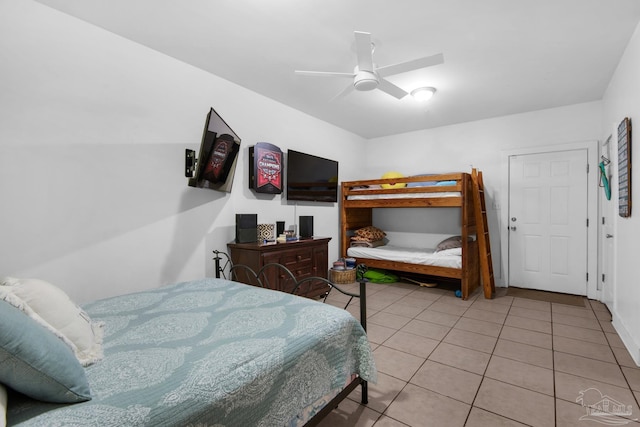 tiled bedroom with ceiling fan