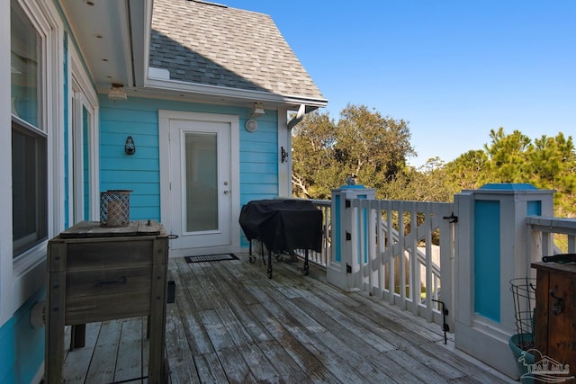 wooden terrace with area for grilling