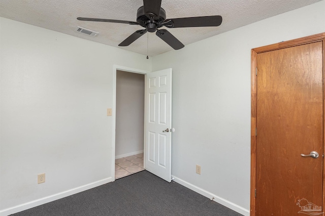 7026 Balboa Dr, Pensacola, FL 32526 - unfurnished bedroom featuring a textured ceiling, carpet floors, and a ceiling fan