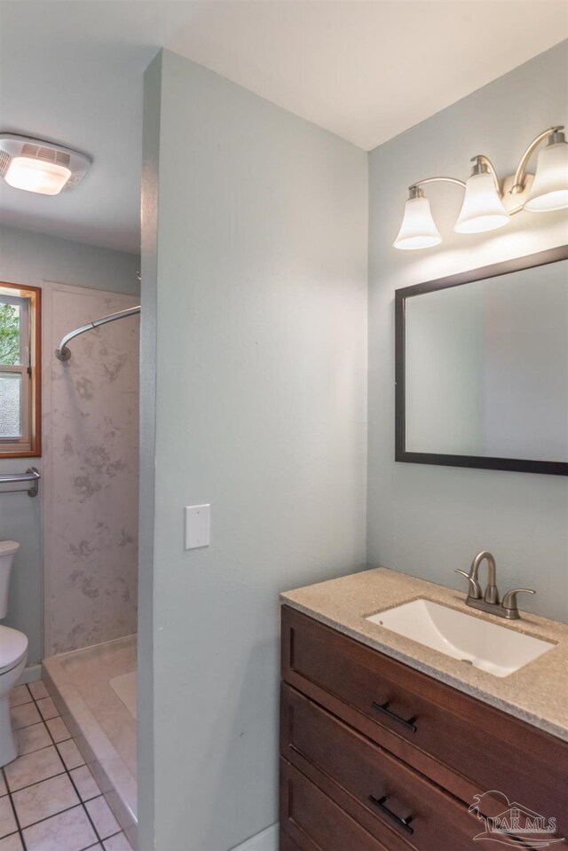 7026 Balboa Dr, Pensacola, FL 32526 - full bathroom featuring vanity, a stall shower, and tile patterned flooring