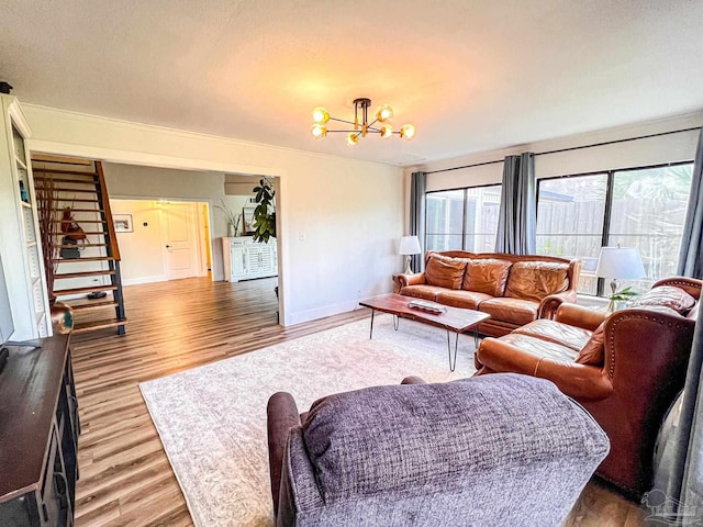 4718 Huron Dr, Pensacola, FL 32507 - living area featuring light wood-type flooring, a chandelier, baseboards, and stairs