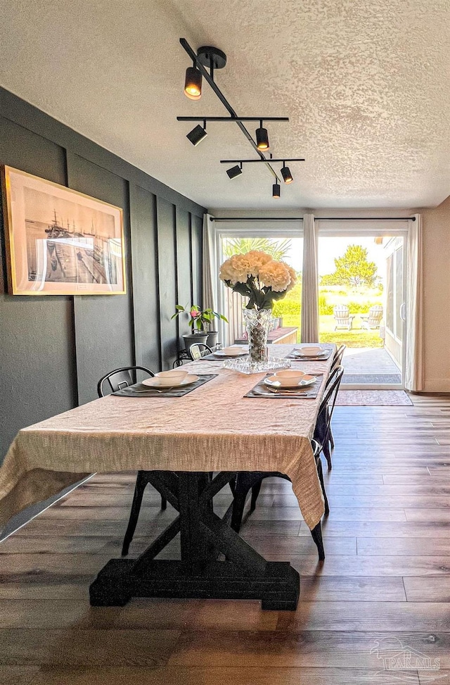 4718 Huron Dr, Pensacola, FL 32507 - dining space featuring a textured ceiling and wood finished floors