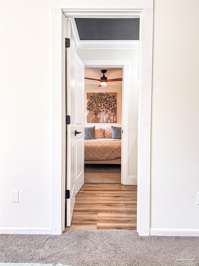 4718 Huron Dr, Pensacola, FL 32507 - corridor with light wood finished floors, light carpet, and baseboards