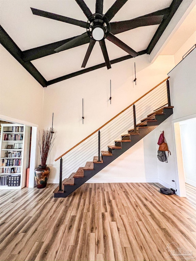 4718 Huron Dr, Pensacola, FL 32507 - staircase with wood finished floors, baseboards, ceiling fan, beam ceiling, and coffered ceiling