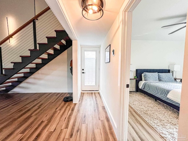 4718 Huron Dr, Pensacola, FL 32507 - foyer entrance with wood finished floors, stairway, baseboards, and a ceiling fan