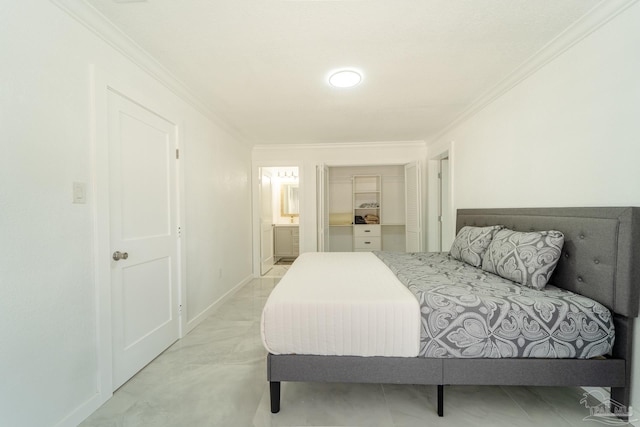 bedroom with ornamental molding and connected bathroom