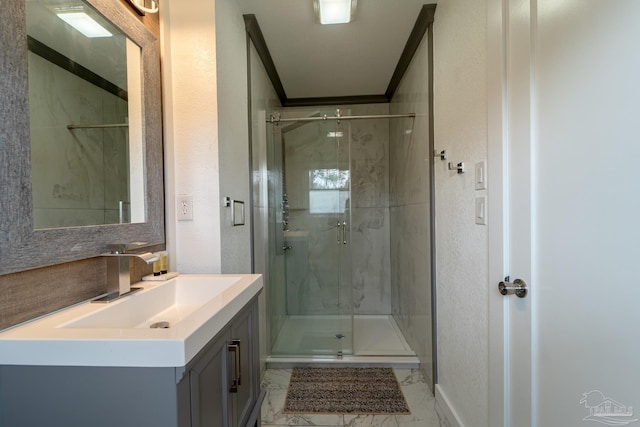 bathroom featuring vanity, crown molding, tasteful backsplash, and walk in shower