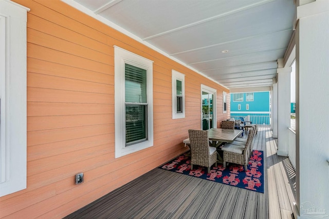 deck featuring outdoor dining area