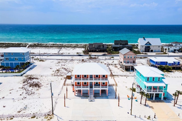 bird's eye view featuring a view of the beach and a water view