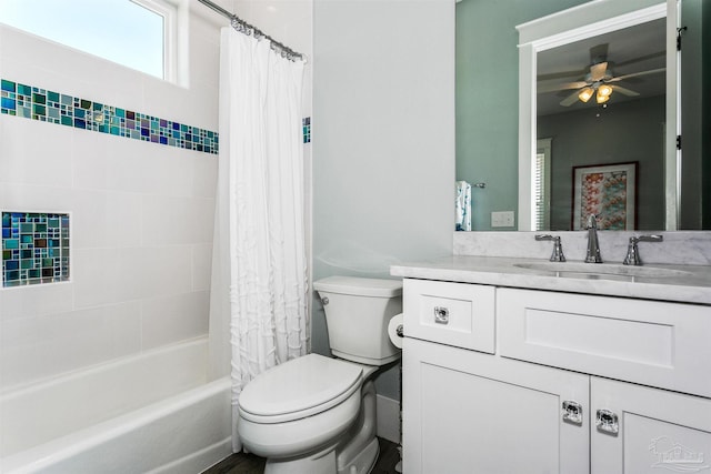 full bath featuring shower / bath combo, vanity, toilet, and a ceiling fan