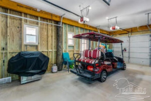 garage featuring a garage door opener