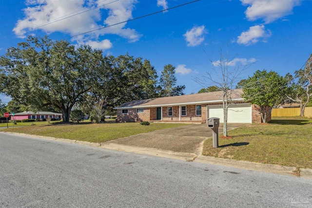 ranch-style house with a garage and a front lawn