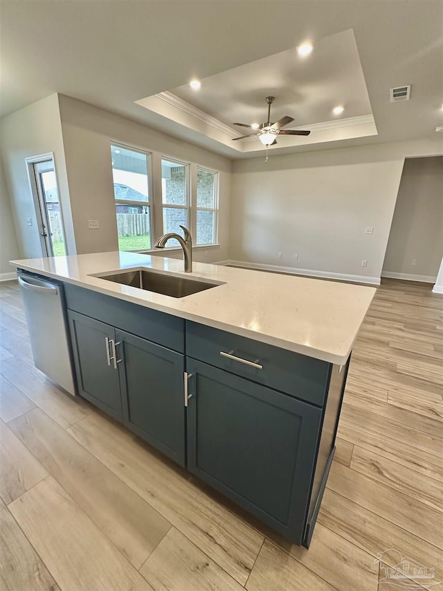 1644 Slate Dr, Cantonment, FL 32533 - kitchen with a sink, a raised ceiling, stainless steel dishwasher, an island with sink, and ornamental molding