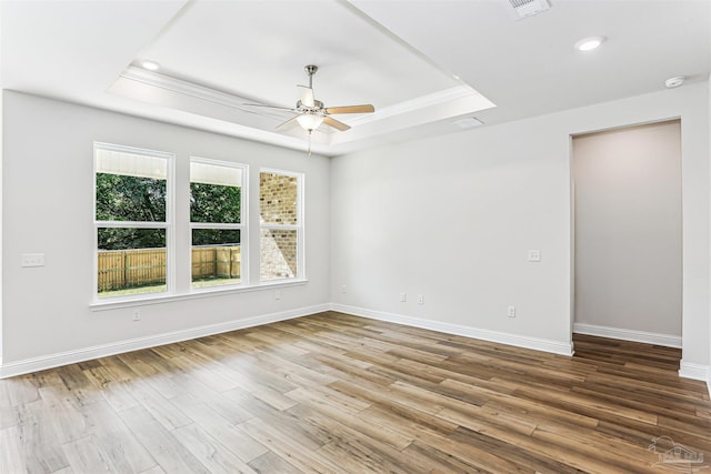 1644 Slate Dr, Cantonment, FL 32533 - unfurnished room with a raised ceiling, a ceiling fan, baseboards, wood finished floors, and recessed lighting