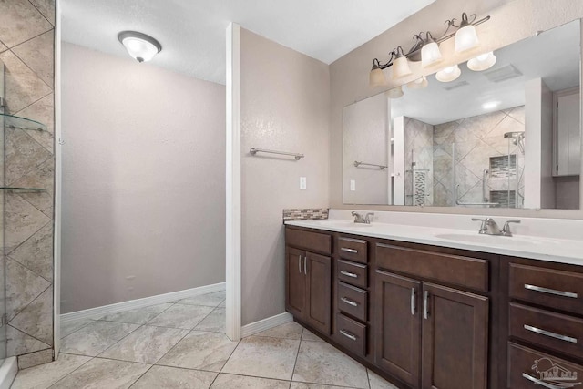 bathroom with a shower with door and vanity