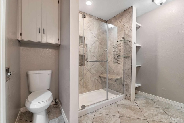 bathroom featuring toilet and walk in shower