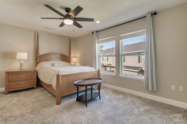 bedroom featuring ceiling fan and light colored carpet