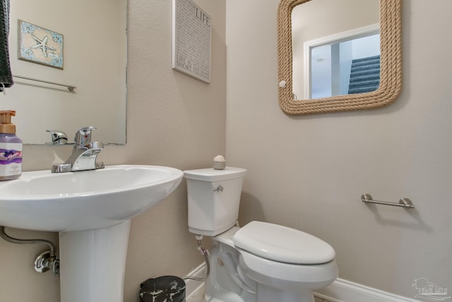 bathroom with sink and toilet