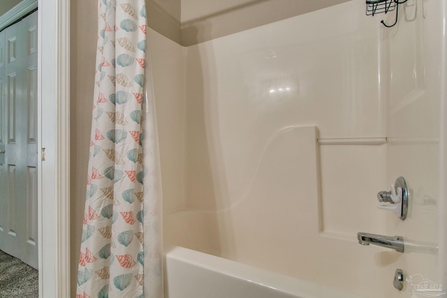 bathroom featuring shower / bathtub combination with curtain