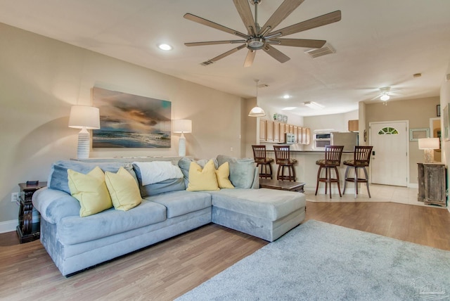 living room with light hardwood / wood-style flooring